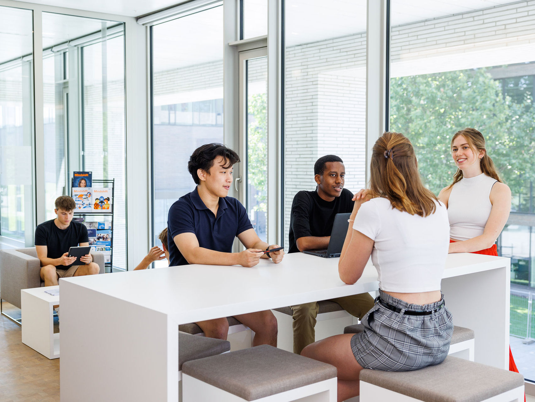 Diverse group f students studying at library